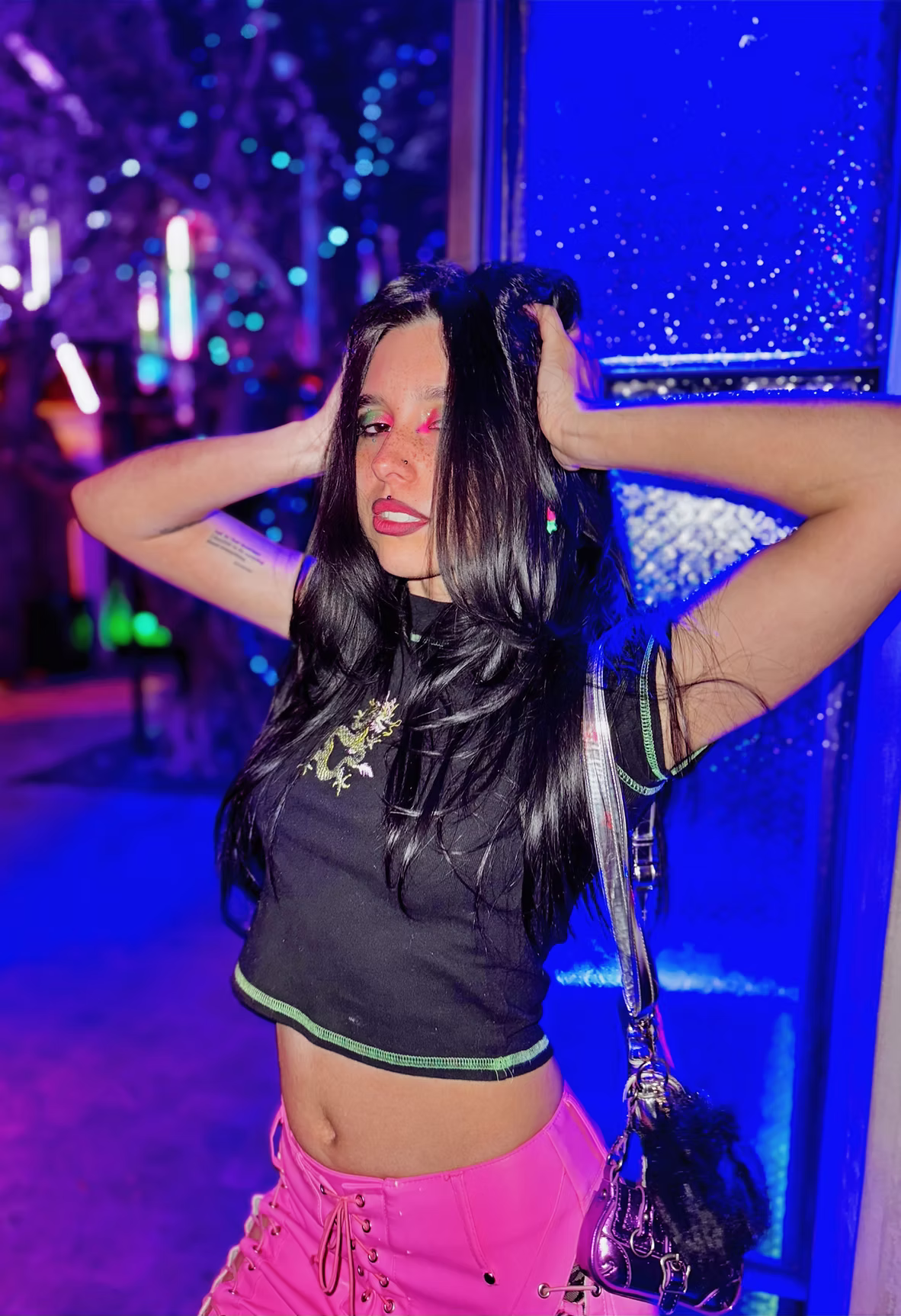 Phone Stealing Club performer in a neon-lit club